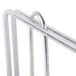 A close-up of a Metro stainless steel wire shelf divider on a metal rack.