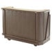 A brown Cambro portable bar on wheels.