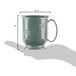 A hand holding a white Cambro Shoreline insulated mug.