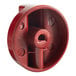 A red plastic Vulcan knob with holes.