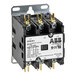 A black and white Cleveland three phase contactor.