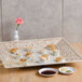 A GET Olympia melamine square plate with sushi, chopsticks, and sauces.