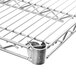 A Metro Super Erecta chrome wire shelf with a metal lock clip.