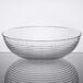 A close up of a clear Cambro round ribbed bowl.