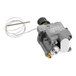 A grey metal gas valve with a wire attached.