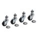 A package of four black US Range casters with rubber wheels.