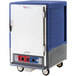 A blue and grey Metro C5 heated holding and proofing cabinet with wheels.