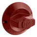 A red round control knob with a letter on it.