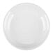 A close-up of a white Tuxton Concentrix saucer with a circular pattern on it.