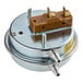 A metal round air flow switch with two wires coming out of the top.
