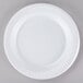 A close-up of a Dart white laminated foam plate with a pattern on it.