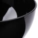 A close up of a black Fineline plastic bowl.