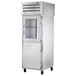 A silver True pass-through refrigerator with a glass half door.