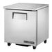 A silver True undercounter freezer on wheels.