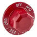 A red Vulcan thermostat knob with white text and a hexagon shape.