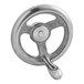 A close-up of a silver metal Cleveland handwheel with a handle on it.