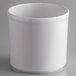 A white round melamine condiment jar on a gray surface.