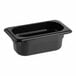 A black Cambro polycarbonate food pan on a counter.