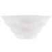 A close-up of a CAC bone white porcelain bowl with a curved design.