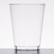 A Fineline clear hard plastic tumbler on a white table.