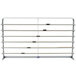 A gray metal rack with metal bars for holding paper rolls.