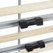 A close-up of a metal Bulman paper cutter rack with black and white details.