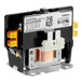 A black and silver Manitowoc Ice contactor with a black cover and yellow and white wires.