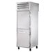 A True stainless steel pass-through refrigerator with solid doors.