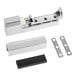 A metal hinge assembly set with a chrome finish, including the main hinge, cover, two mounting plates, and a black plastic component.
