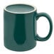 A green Tuxton china mug with a white rim and C-handle.