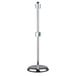 A metal pole with a black base and chrome legs.