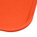 A Carlisle orange plastic fast food tray.