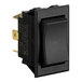 A close-up of a black toggle switch with a gold knob.