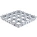 A white plastic grid with holes for stemware.