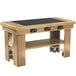 A wooden Vollrath induction buffet table with wheels.