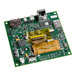 A green circuit board with a chip and many electronic components.