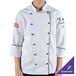 A person wearing a white Chef Revival ladies long sleeve coat with black trim.