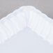 A white rectangular plastic tray with a scalloped edge.