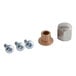 A close-up of nuts and bolts on a metal table.