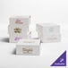A group of white customizable bakery boxes with different designs.