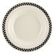 A close-up of a Homer Laughlin creamy white china soup bowl with black and white checkered trim.