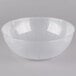 A clear plastic bowl with lines on it.