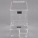 A clear plastic box with a Cal-Mil topping dispenser and a lid.