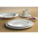 A Homer Laughlin Pristine Ameriwhite bright white china plate on a table.