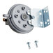 A Henny Penny Vac Switch Kit, a small round metal device with screws and a metal bracket with holes.