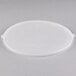 A white plastic lid on a clear plastic bowl.