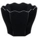 A black plastic hexagon bowl with wavy edges.