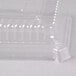 A clear plastic Fineline serving tray dome lid on a clear plastic container.
