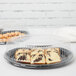 Two Fineline clear plastic trays with pastries on them.