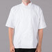 A man wearing a white Mercer Culinary chef's coat.